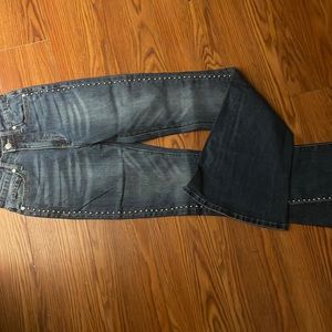 Long flared jeans with silver dome studs